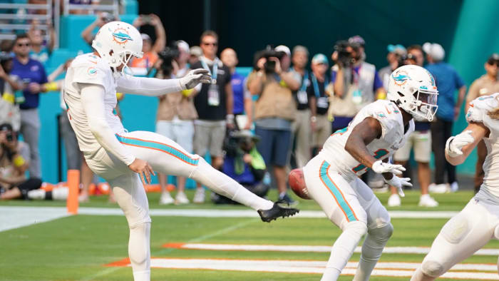 Sep 25, 2022; Miami Gardens, Florida, USA; Miami Dolphins punter Thomas Morstead (4) punts the ball into the backside of wide receiver Trent Sherfield (14) resulting in a safety for the Buffalo Bills during the second half at Hard Rock Stadium.
